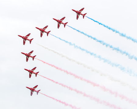 LEEUWARDEN, THE NETHERLANDS - JUNE 10, 2016: RAF Red Arrows performing at the Dutch Air Force Open House on June 10, 2016 at Leeuwarden Airfield, The Netherlands.のeditorial素材