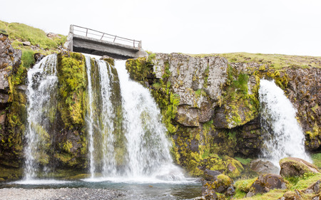 Kirkjufellsfoss waterfall near the Kirkjufell mountain on the north coast of Iceland's Snaefellsnes peninsulaの写真素材