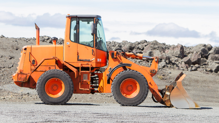 Large orange bulldozer on a building site