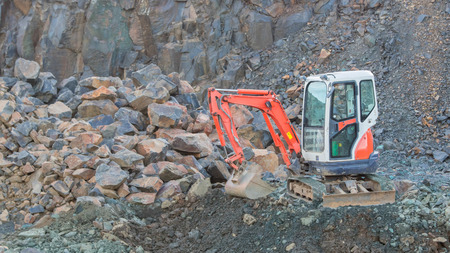 Small orange bulldozer on a building site