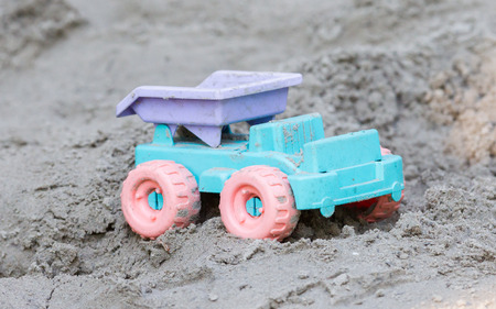 Children's machine in the sand, selective focus