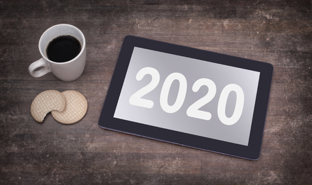Tablet touch computer gadget on wooden table, vintage look - 2020の写真素材