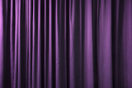 Close-up of closed curtain with light spots in a theaterの写真素材