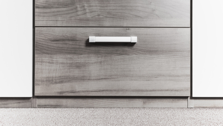 Modern cupboard with drawers, selective focus, metal handlesの写真素材
