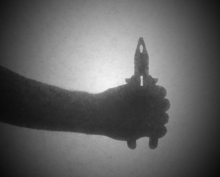 Silhouette behind a transparent paper - Small pliersの写真素材