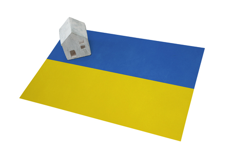 Small house on a flag - Living or migrating to Ukraineの写真素材