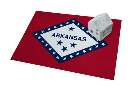 Small house on a flag - Living or migrating to Arkansasの写真素材