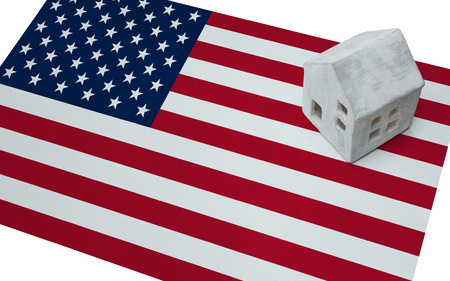 Small house on a flag - Living or migrating to USAの写真素材