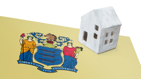 Small house on a flag - Living or migrating to New Jerseyの写真素材