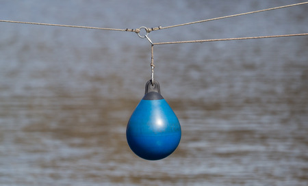 BLue buoy hanging out to dry, selective focusの写真素材
