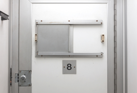 Inside of a large bus used by the department of justice to transport prisoners for public safetyの写真素材