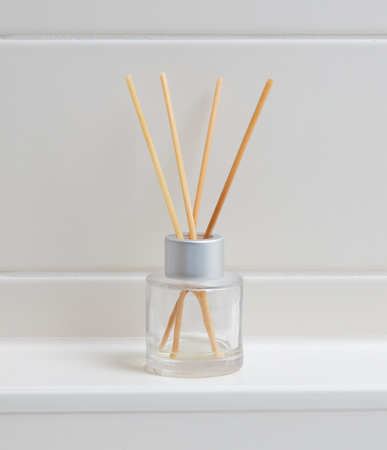 Aroma sticks in the bottle in a bathroomの写真素材