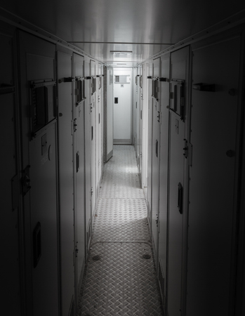 Inside of a large bus used by the department of justice to transport prisoners for public safetyのeditorial素材