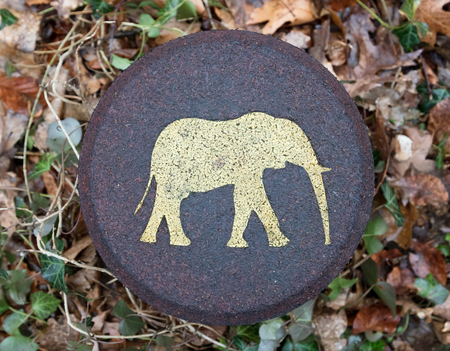 Elephant symbol on a pole in a forrest