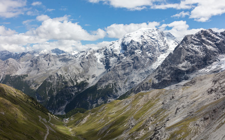 View from the top of famous Italian Stelvio High Alpine Road, elevation of 2,757 m above sea level. Stelvio Pass, South Tyrol, province of Sondrio, Ortler Alps, Italy, Europe.の写真素材