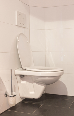 Modern white toilet bowl in the bathroomの写真素材