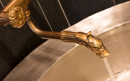 Unique brass faucet - Interior of a saunaの写真素材