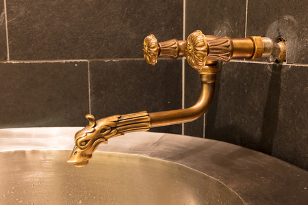 Unique brass faucet - Interior of a saunaの写真素材