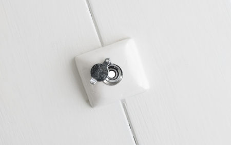 Peephole on wooden door - Security check before opening the doorの写真素材