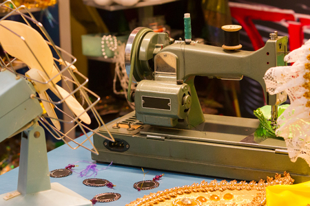 Sewing machine on table in workshop - Vintage settingの写真素材