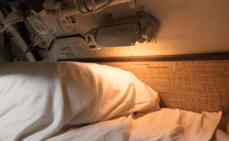 Interior of an old submarine - Limited space and lots of equipmentの写真素材
