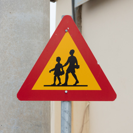 Iceland: warning sign of children crossing street from schoolの写真素材