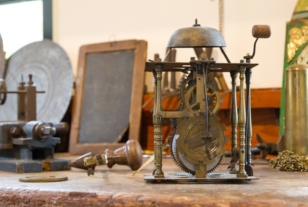 Old clock workshop, selective focus on the clock