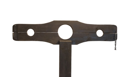 Medieval pillory isolated on a white backgroundの写真素材