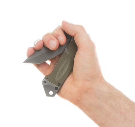 Criminality - Sharp pocketknife in the gand of a manの写真素材