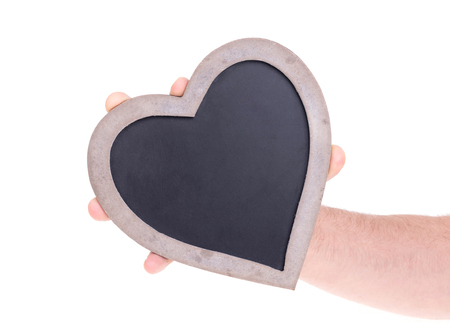 Adult holding heart shaped chalkboard - Isolated on whiteの写真素材
