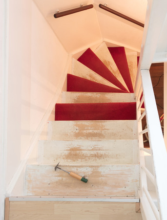 Removing carpet, glue and paint from an vintage stairs - Selective focusの写真素材