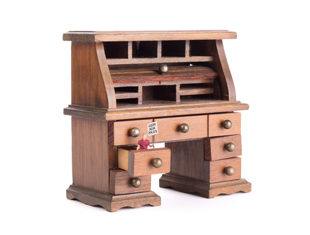 Small vintage wooden desk, small man with sigh - Clean desk policyの写真素材