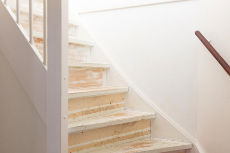 Removing carpet, glue and paint from an vintage stairs - Selective focusの写真素材
