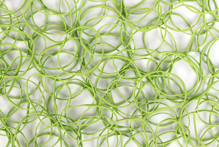 Close view small rubber bands on a white background