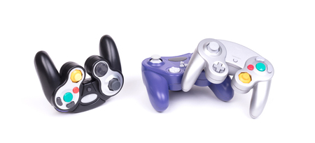 Video game controllers on white background