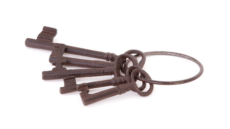 Antique keys on a ring on a white background
