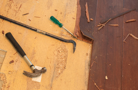 Breaking up a solid wooden floor in a houseの写真素材