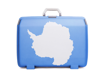 Used plastic suitcase with stains and scratches, printed with flag - Antarcticaの写真素材