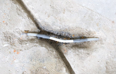 Repairing a broken water pipe in the concrete floor - Renovationの写真素材