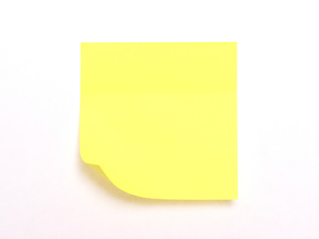 Yellow sticky note isolated on a white background