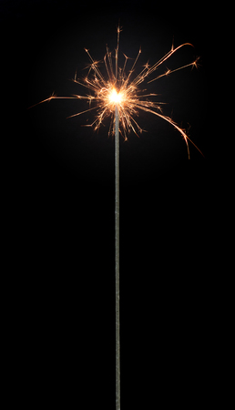Sparkler isolated on a solid black backgroundの写真素材