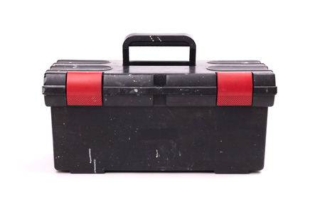 Old dirty black toolbox, isolated on white