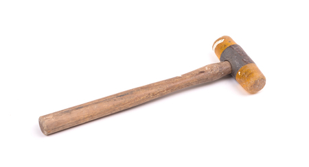 Old wooden hammer isolated on a white background