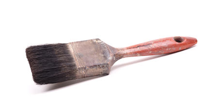 Old and used paint brush, on white backgroundの写真素材