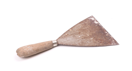 Old putty knife isolated on a white background