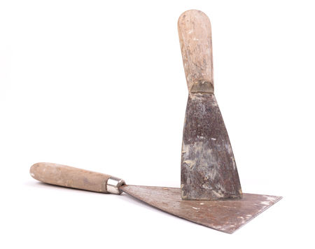 Old putty knifes isolated on a white backgroundの写真素材