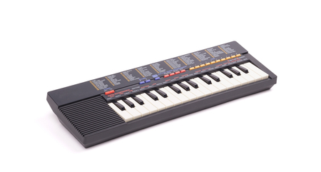 Small old keyboard, isolated on a white backgroundの写真素材