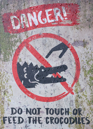 Beware of the crocodiles sign, do not touchの写真素材