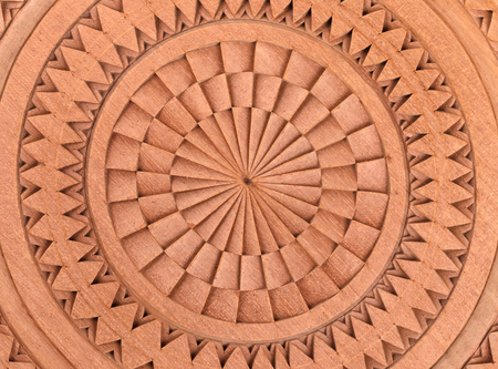 Wooden plate, carving from Suriname, isolated on whiteの写真素材