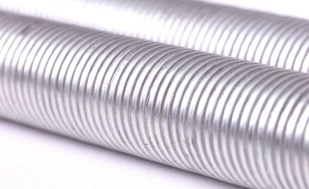 Two metal springs isolated on a white background, selective focus